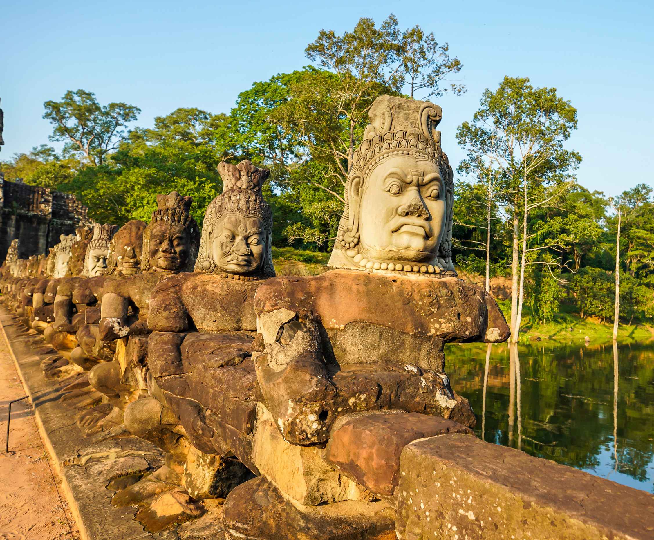 Stone guardian statues at Angkor Thom bridge