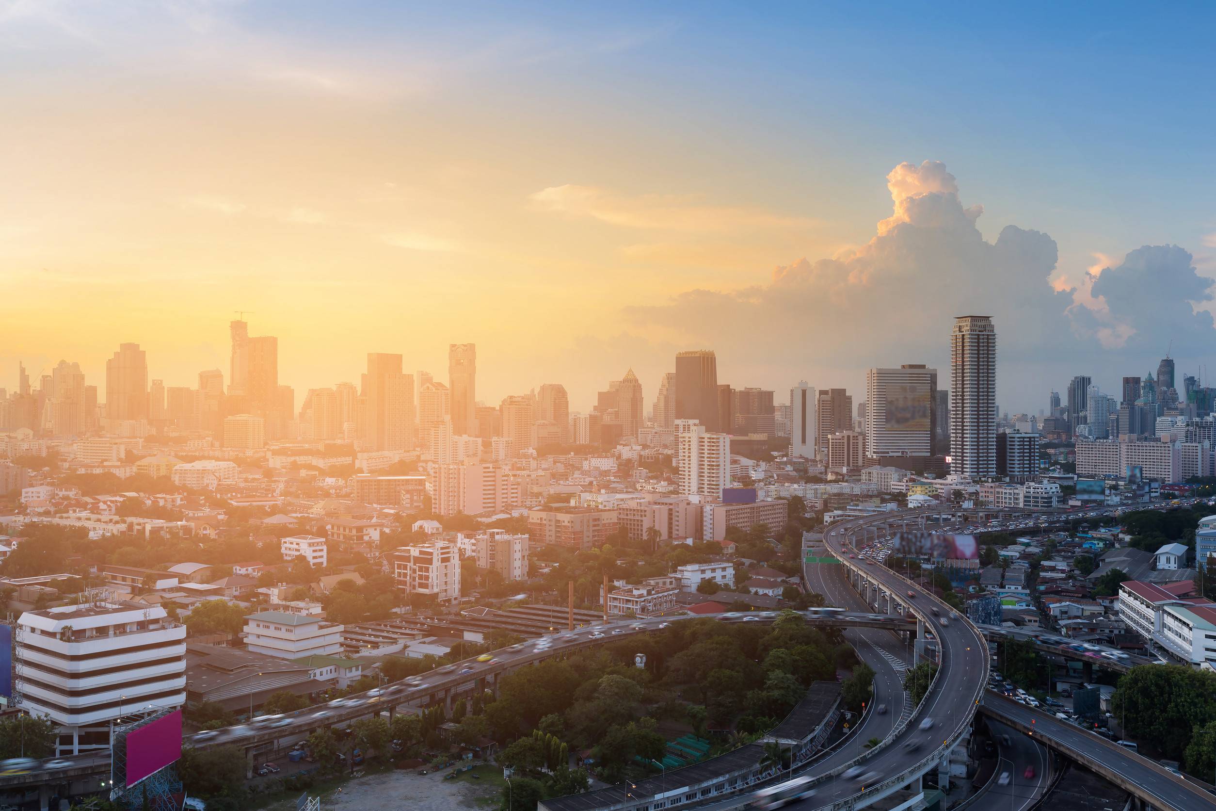 Sunset Over Highway Interchanged With City