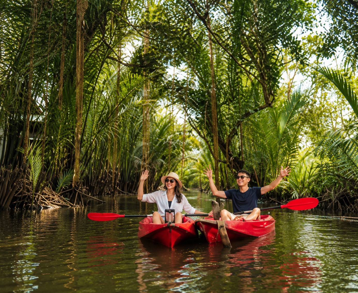 Tourists Doing Kayaking At Riverside Kampot